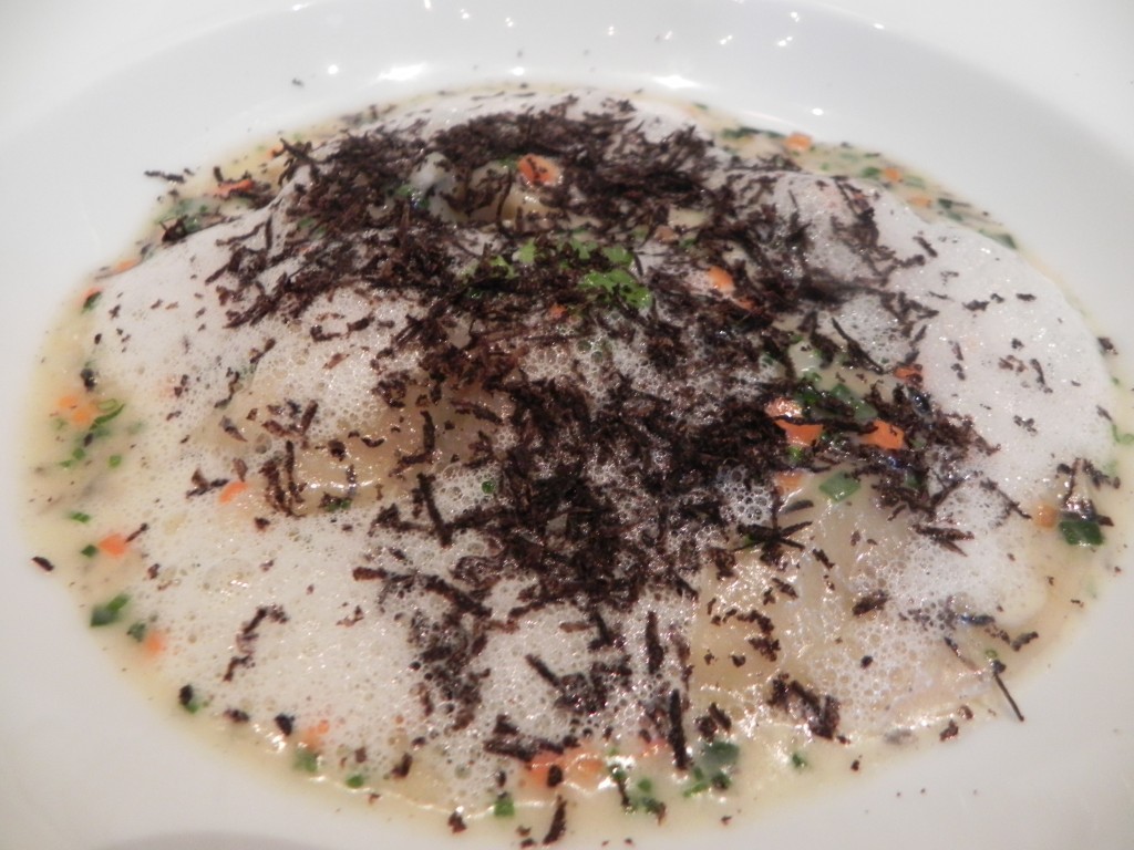 Foie Gras Ravioli with aromatics and parmesan black truffle