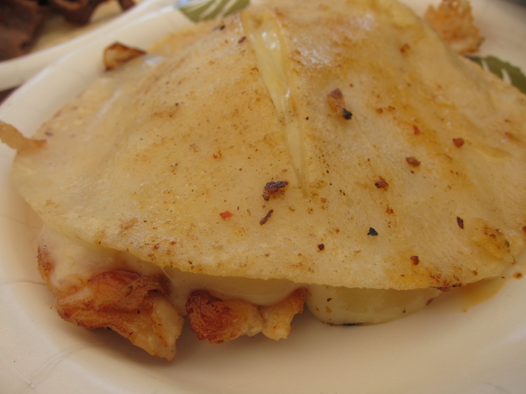 Pechuga Suiza (grilled chicken breast with melted cheese between two corn tortillas)