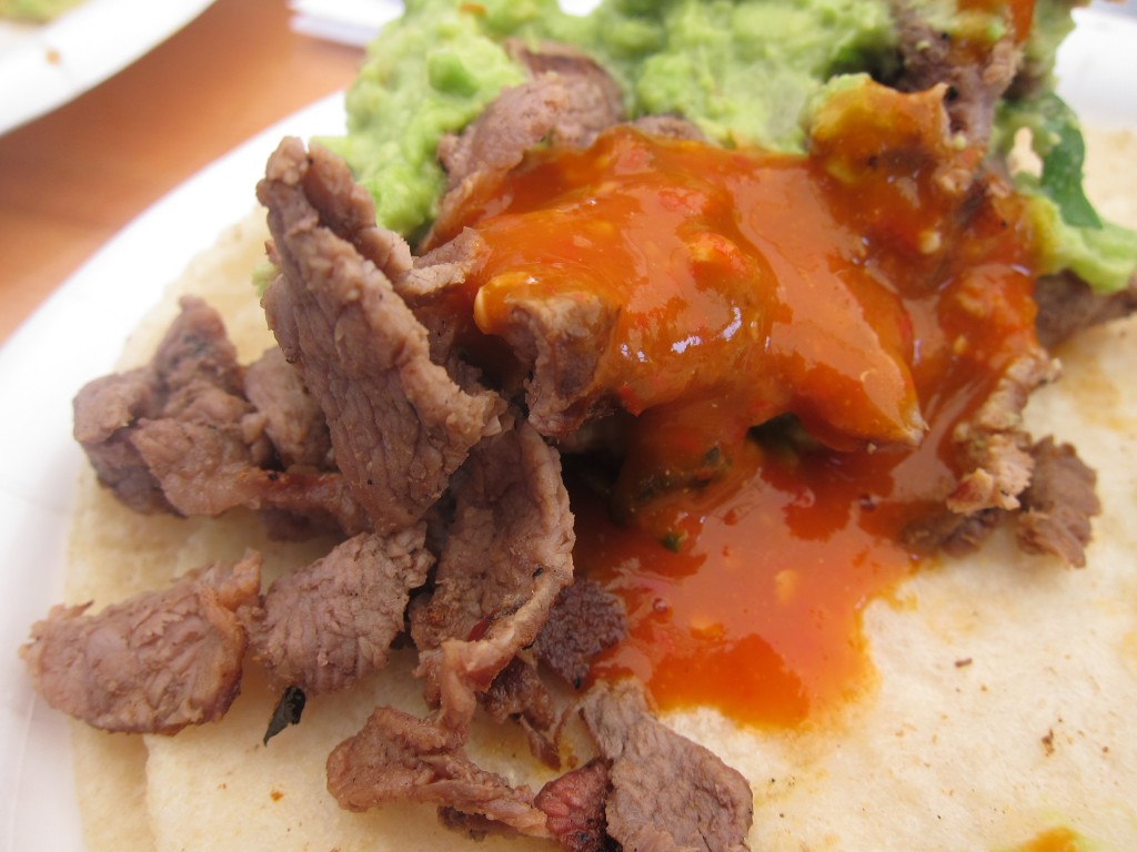 Tacos de Bistec (grilled steak tacos) with salsa and guacamole