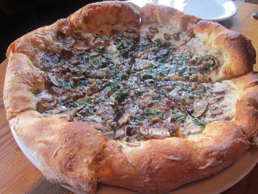 Shaved Mushroom Pizza with Gruyere, Melted Onions, Black Truffle, Torn Parsley, Rosemary and Thyme