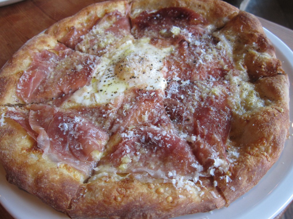 Prosciutto & Farm Egg Pizza with Mozzarella, Gruyere, Pecorino, Chili Flakes, Black Pepper and Sunny-side Up Egg