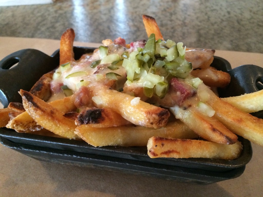 Pastrami Gravy Fries with Beef Tallow Fries, Pastrami Bits Pastrami Gravy, Melted Swiss Cheese and Chopped Pickles 