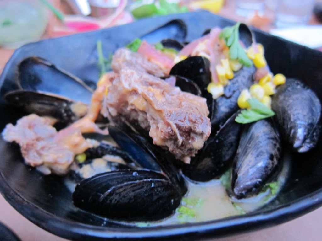 Mussels in Beef Broth with Sweet Corn, Pickled Onions and Oxtail