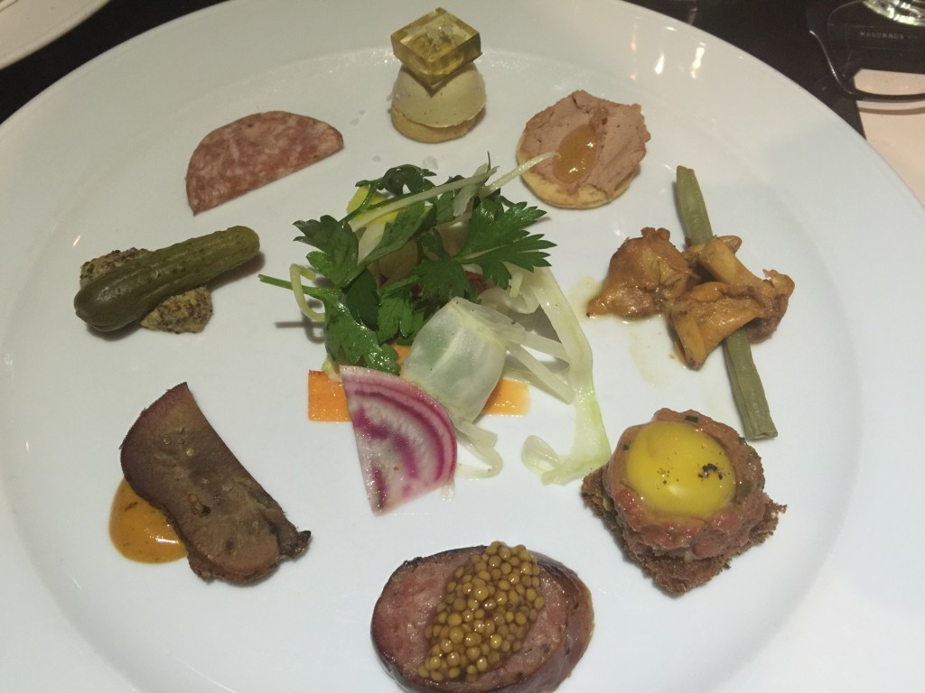 Charcuterie Plate (including Steak Tartare, Quail Egg Toast, Foie Gras Bon Bon, and Beef Tongue Pastrami) from Beast