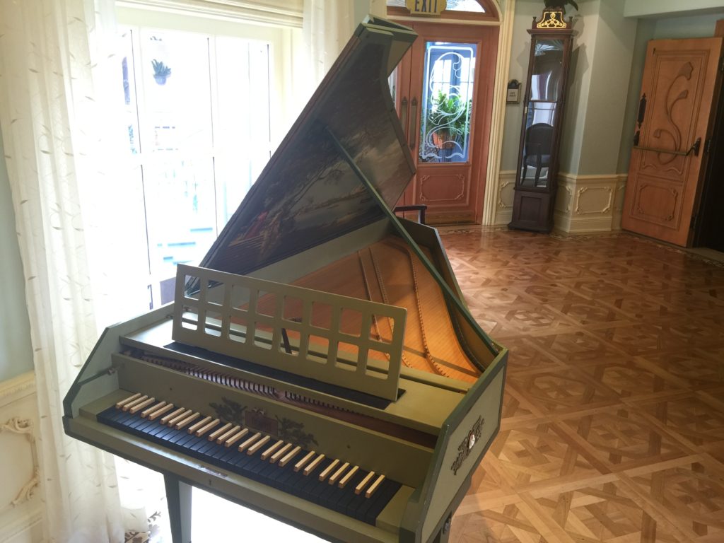 Mrs. Disney's harpsichord in the waiting area