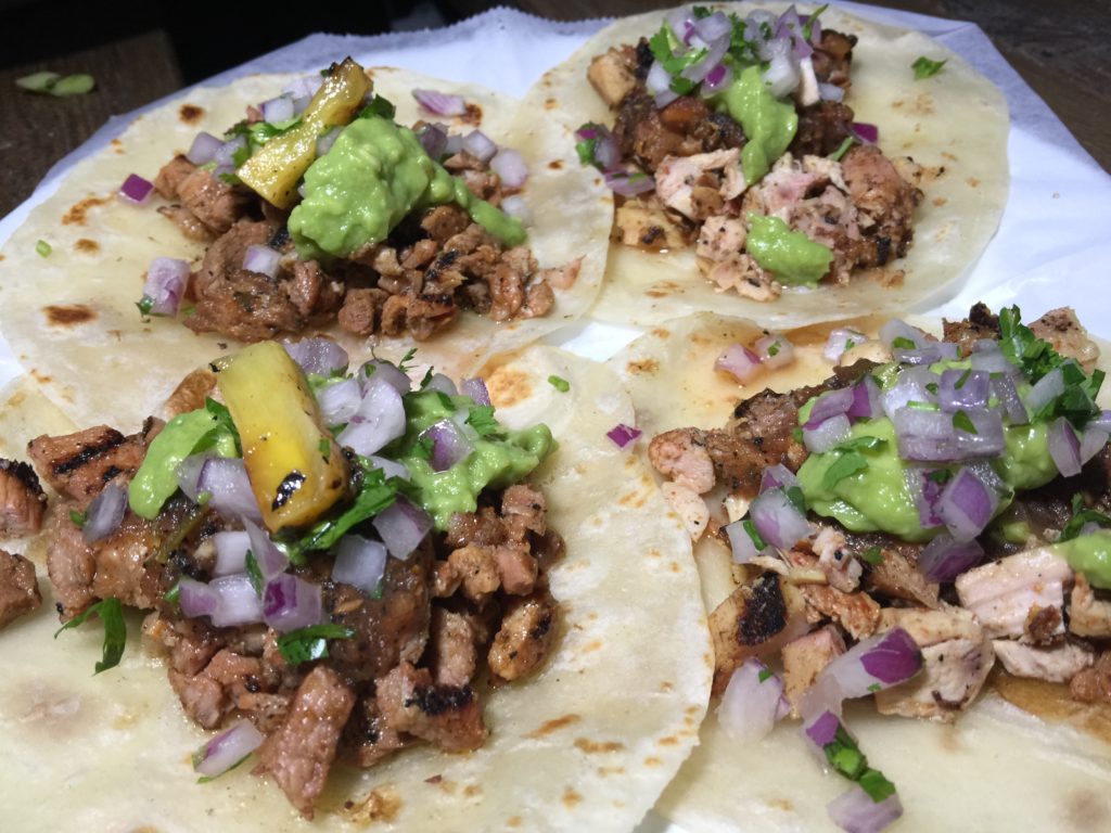 Carne Asada and Pollo Asada Tacos with Avocado, Salsa Vaquera, Cilantro and Onion